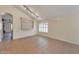 Bright living room with tile flooring, built in shelves, and ample space for entertaining at 2312 E Williams Dr, Phoenix, AZ 85024