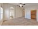 Neutral main bedroom boasts plush carpet, dual closets, and ensuite bathroom at 2312 E Williams Dr, Phoenix, AZ 85024