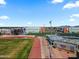 An aerial view showing the track and field with campus buildings, and a clear blue sky at 3107 W Tuckey Ln, Phoenix, AZ 85017