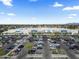 Overhead angle of a Walmart parking lot with many cars on a clear day with some clouds at 3107 W Tuckey Ln, Phoenix, AZ 85017