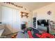 View of a bedroom with a closet and an organized entertainment center at 3107 W Tuckey Ln, Phoenix, AZ 85017