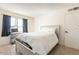Bright bedroom featuring a full size bed, a work space and natural light at 3107 W Tuckey Ln, Phoenix, AZ 85017