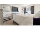 Comfortable bedroom featuring a full size bed, television and natural light at 3107 W Tuckey Ln, Phoenix, AZ 85017