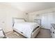 Cozy bedroom with a full size bed, neutral walls and tile floors at 3107 W Tuckey Ln, Phoenix, AZ 85017