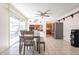 Open dining area with a ceiling fan, seating and access to the kitchen at 3107 W Tuckey Ln, Phoenix, AZ 85017