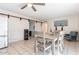Bright dining room features a ceiling fan, neutral walls, and tiled flooring at 3107 W Tuckey Ln, Phoenix, AZ 85017