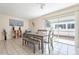 Bright dining room with bench seating and sliding door leading to the outside at 3107 W Tuckey Ln, Phoenix, AZ 85017