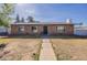 Charming single-story brick home with a well-maintained front yard and walkway at 3107 W Tuckey Ln, Phoenix, AZ 85017