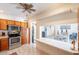 Kitchen view of the dining area, stainless steel appliances, and tile flooring at 3107 W Tuckey Ln, Phoenix, AZ 85017