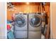 Laundry room equipped with modern washer and dryer units at 3107 W Tuckey Ln, Phoenix, AZ 85017
