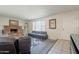 Inviting living room featuring a cozy brick fireplace and neutral decor at 3107 W Tuckey Ln, Phoenix, AZ 85017