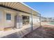 The patio has a full size refrigerator, a sitting area, and leads to a pool area at 3107 W Tuckey Ln, Phoenix, AZ 85017