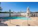 A backyard pool that is fenced and includes two umbrellas at 3107 W Tuckey Ln, Phoenix, AZ 85017