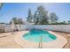 View of a backyard pool with an umbrella and shade area at 3107 W Tuckey Ln, Phoenix, AZ 85017
