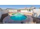 Backyard swimming pool surrounded by patio and white fencing at 3107 W Tuckey Ln, Phoenix, AZ 85017