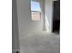 Bright bedroom with a view of the neighborhood and space for furniture at 32677 N Newby Dr, San Tan Valley, AZ 85143