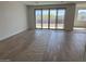 Spacious living room with sliding glass doors and tile flooring, offering great views at 32677 N Newby Dr, San Tan Valley, AZ 85143