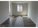 Living room with new floors and a window providing natural light at 32677 N Newby Dr, San Tan Valley, AZ 85143