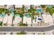 Aerial view of neighborhood showcasing home with lush landscaping and sparkling pool and spa at 3440 E Topeka Dr, Phoenix, AZ 85050
