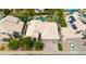 Aerial view of property showcasing lush landscaping, sparkling pool and mature trees at 3440 E Topeka Dr, Phoenix, AZ 85050