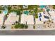 Aerial view of property with lush landscaping, sparkling pool, and large yards at 3440 E Topeka Dr, Phoenix, AZ 85050
