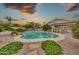 Gorgeous backyard pool with lush desert landscaping at 3440 E Topeka Dr, Phoenix, AZ 85050