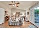 Cozy bedroom with ceiling fan, french doors, and hardwood floors at 3440 E Topeka Dr, Phoenix, AZ 85050