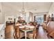Elegant dining room with a chandelier, hardwood floors, and natural light at 3440 E Topeka Dr, Phoenix, AZ 85050