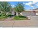 Charming single-Gathering home featuring a manicured front yard and a two-car garage at 3440 E Topeka Dr, Phoenix, AZ 85050
