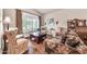 Living room with hardwood floors, neutral walls, large window, and comfortable seating at 3440 E Topeka Dr, Phoenix, AZ 85050