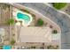 Aerial view of backyard oasis featuring a freeform pool with rock accents at 35656 N Shorthorn Trl, San Tan Valley, AZ 85143