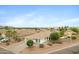 Beautiful aerial shot showcases a home with desert landscaping, surrounded by neighboring properties at 35656 N Shorthorn Trl, San Tan Valley, AZ 85143