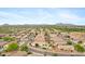 Expansive aerial shot showcasing a well-maintained desert community with neatly arranged homes and streets at 35656 N Shorthorn Trl, San Tan Valley, AZ 85143