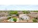 Beautiful backyard with a freeform pool and desert landscaping, perfect for outdoor relaxation at 35656 N Shorthorn Trl, San Tan Valley, AZ 85143