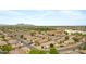 Extensive aerial view captures a vast residential area and desert landscape, set against distant mountains at 35656 N Shorthorn Trl, San Tan Valley, AZ 85143