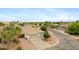 Expansive aerial view of a single-Gathering home with a desert landscape and palm trees at 35656 N Shorthorn Trl, San Tan Valley, AZ 85143
