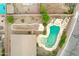 Overhead view of a backyard with a lagoon-style pool and well-kept desert landscaping at 35656 N Shorthorn Trl, San Tan Valley, AZ 85143