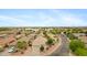 Wide aerial perspective of a community featuring tile-roofed houses and desert landscaping at 35656 N Shorthorn Trl, San Tan Valley, AZ 85143