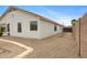 Back of home showcasing desert landscaping and block wall fence at 35656 N Shorthorn Trl, San Tan Valley, AZ 85143