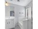 Bright bathroom featuring a tub, glass enclosed shower and large mirror over a white vanity at 35656 N Shorthorn Trl, San Tan Valley, AZ 85143