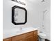 Bathroom featuring wood vanity, sink, mirror and a tub-shower combo with a toilet at 35656 N Shorthorn Trl, San Tan Valley, AZ 85143