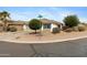 Charming single-story home features a well-kept landscape, including gravel and decorative shrubs at 35656 N Shorthorn Trl, San Tan Valley, AZ 85143