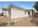 A close-up of the side of the home reveals a modern design and a well-kept yard at 35656 N Shorthorn Trl, San Tan Valley, AZ 85143