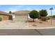 A charming single-Gathering home boasting a well-manicured front yard and a two-car garage at 35656 N Shorthorn Trl, San Tan Valley, AZ 85143