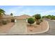 Charming single-story home with a well-manicured front yard and a two-car garage at 35656 N Shorthorn Trl, San Tan Valley, AZ 85143