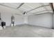 Spacious two car garage with water heater and light gray walls at 35656 N Shorthorn Trl, San Tan Valley, AZ 85143