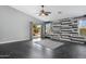 The living area offers stylish flooring, neutral walls, backyard view, ceiling fan, and a modern feel at 35656 N Shorthorn Trl, San Tan Valley, AZ 85143