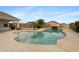 Backyard pool with rock waterfall feature and lush landscaping at 35656 N Shorthorn Trl, San Tan Valley, AZ 85143