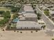 Aerial shot of the home's backyard, including the pool and the community park nearby at 35773 N Loemann Dr, San Tan Valley, AZ 85143