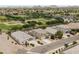 Expansive aerial view of a suburban neighborhood with modern homes and a community park with baseball fields at 35773 N Loemann Dr, San Tan Valley, AZ 85143